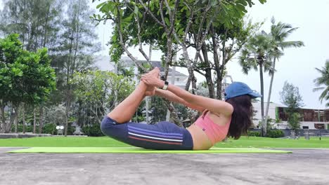 woman practicing yoga outdoors