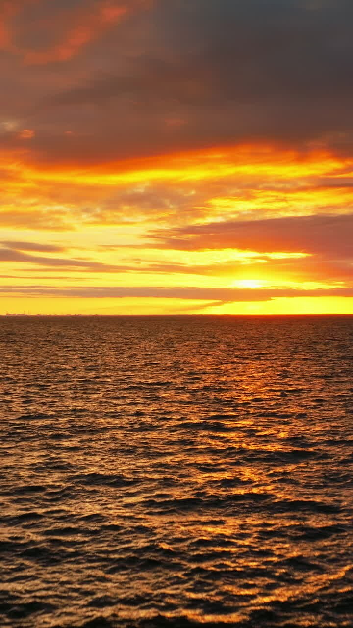 Aerial drone view of the North sea in Denmark at sunset. Vertical