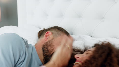 Funny,-crazy-and-playful-couple-in-bed-laughing