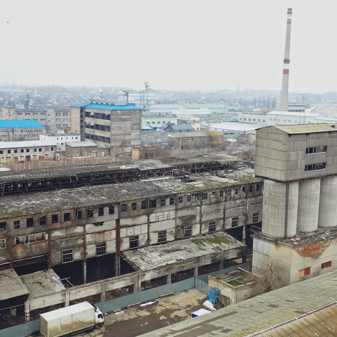 Flight over the destroyed factory. Old industrial building for demolition. Aerial view