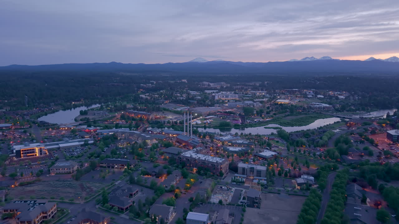 Drone view of the old mill district in Bend Oregon. Drone flying forward towards Old Mill and River.