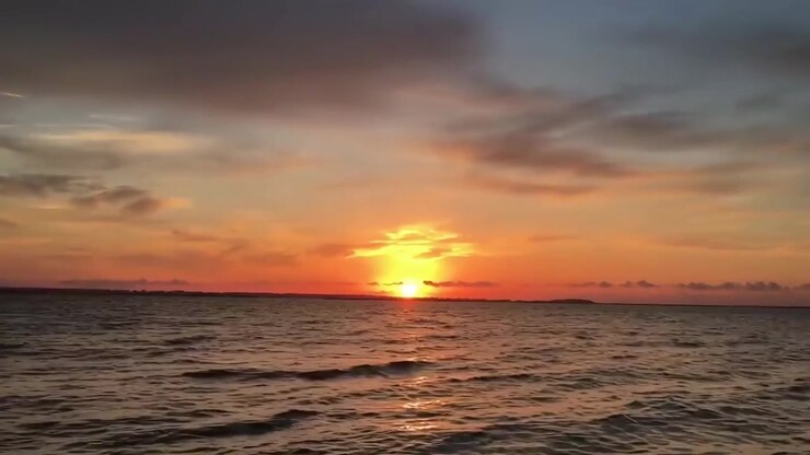 Golden Sunset Over Calm Ocean Waves