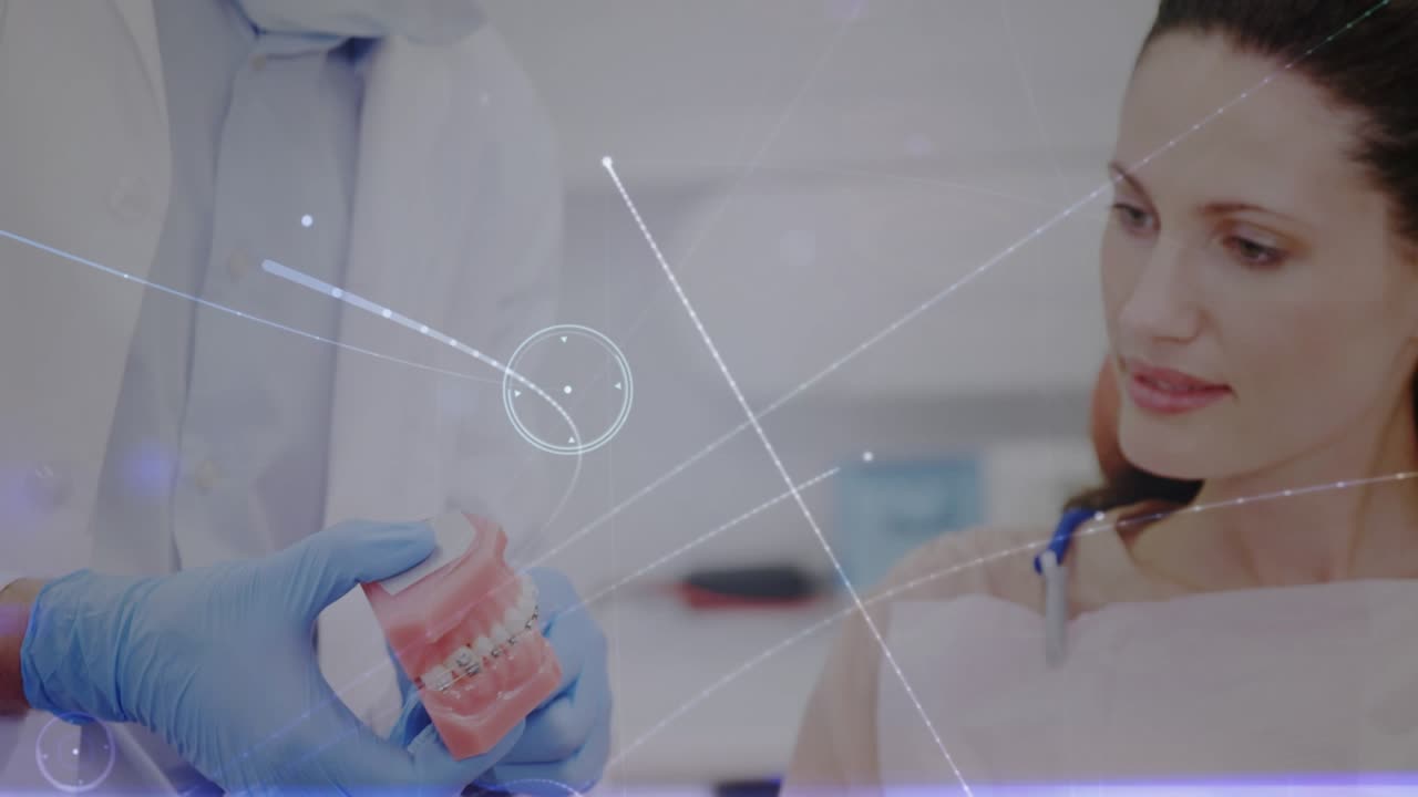 Animation of data processing over male dentist talking with patient