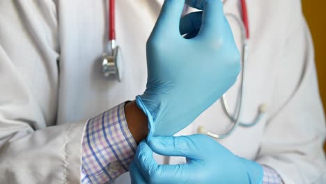 doctor putting on gloves