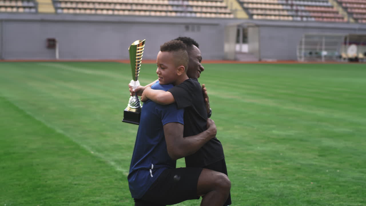 Father and Son Celebrating a Soccer Victory
