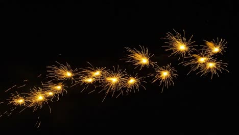 A Spectacular Display of Sparkling Fireworks: Capturing the Magic of Light and Color in Two Frames, Showcasing the Chaotic Beauty of a Vibrant Night Sky