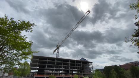 Hand-held,-crane-over-a-construction-site-in-Durham,-NC