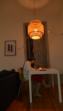 woman studying at home in cozy winter decor