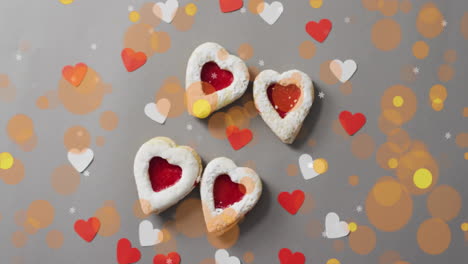 heart-shaped cookies with jam filling over heart and bokeh animation