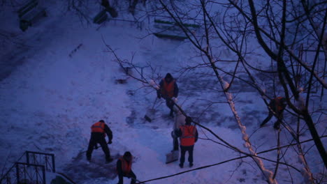 Street-cleaners-in-orange-uniform