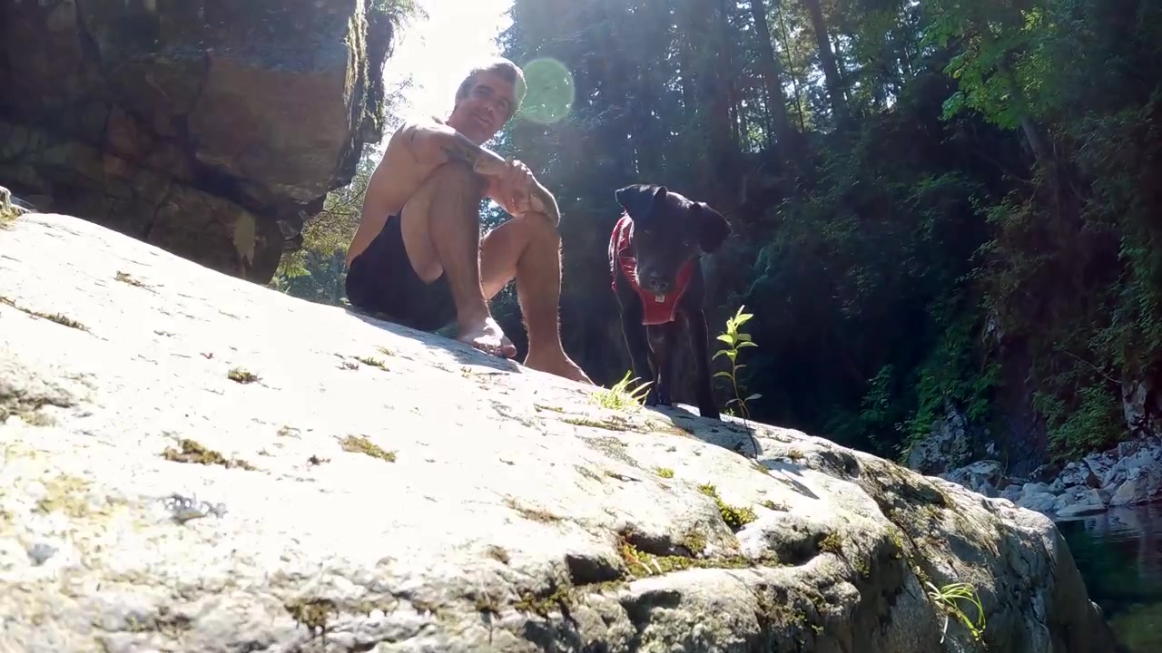 Snorkeling in Inter River Canyon in North Vancouver, British Columbia, Canada, with river surrounded by rocky canyon terrain and forest