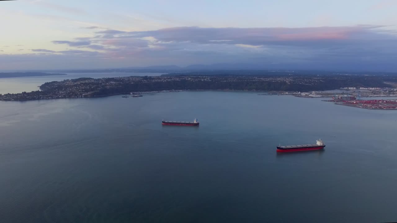 Ships Adrift On The Dark Blue Sea At The Commencement Bay In Washington, USA On A Sunset - Aerial Shot