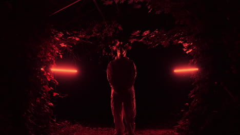 mysterious figure in red light