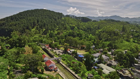 Ella-Sri-Lanka-Aerial-v36-flyover-railway-station-and-town-center-capturing-winding-mountain-roads,-hillside-resort-hotels,-rock-view-point-mountainous-landscape---Shot-with-Mavic-3-Cine---April-2023