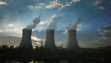 steaming cooling towers of nuclear power plant