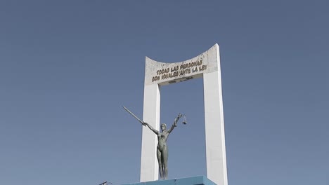 A-tilt-down-shot-to-the-Monumento-a-La-Constitución-in-San-Salvador-during-a-sunny-day