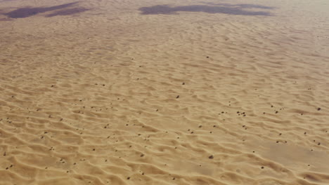 vast immense desert of dubai, sand copy space seen from above, middle east