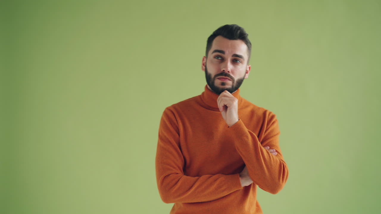 Man in Orange Sweater Thinking