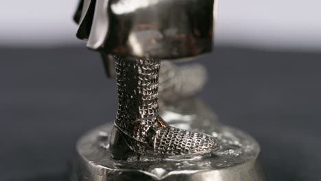 medieval-knight's-feet-silver-armor-close-up