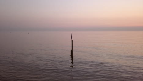 aerial shot of a calm northsea beach during sunset