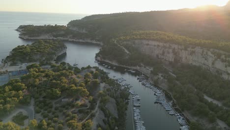 aerial drone fly above boats calanques marseille mountain sunset river landscape