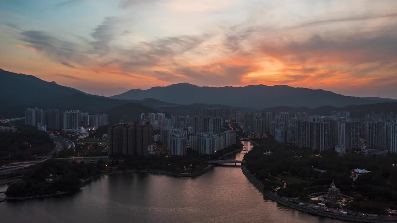 Time lapse of the city with fiery sky vibrant sunset and traffic ...