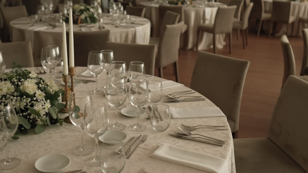 elegant round table set for wedding with flowers and soft lighting