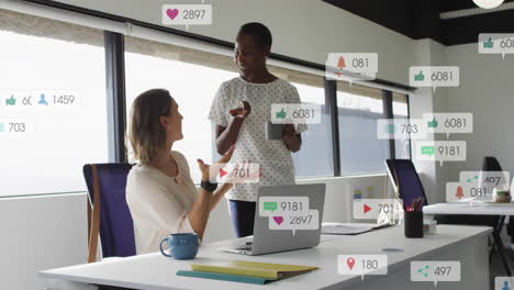 Animation-of-notification-bars-over-diverse-female-coworkers-drinking-coffee-and-discussing-on-desk