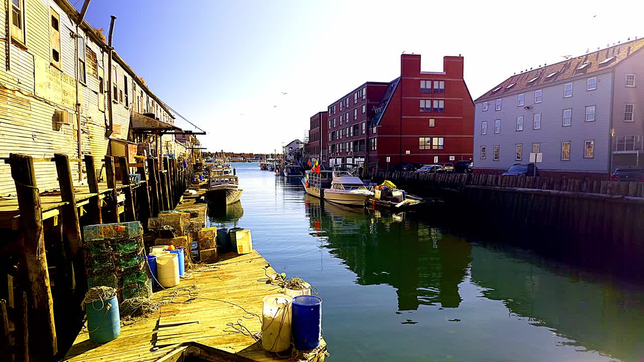 Scenic view of a harbor with fishing boats and buildings