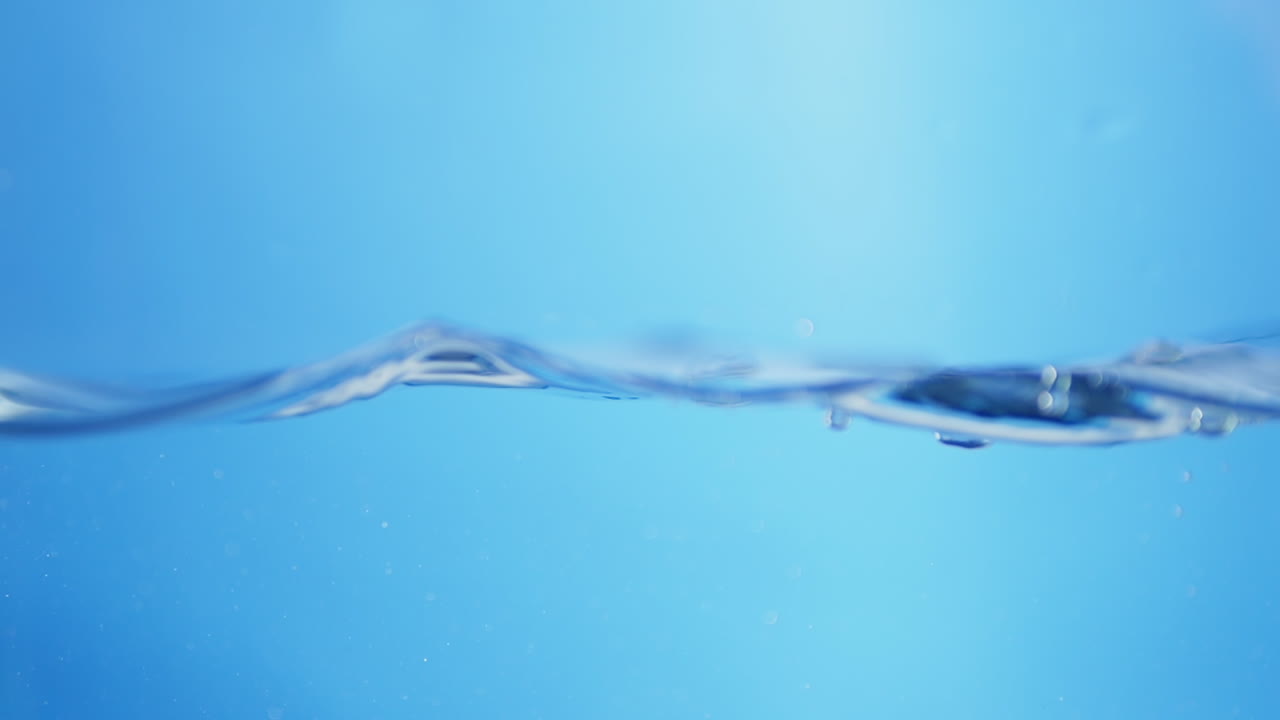 Stunning imagery of water waves in slow motion, focusing on the clarity and freshness that symbolize quality drinking water.