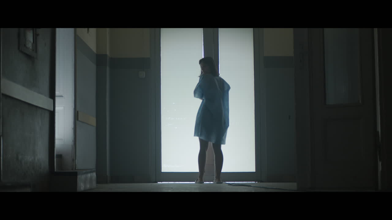 A girl runs through strange corridors of abandoned hospital