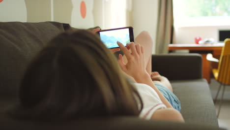 a woman looking through photos on her cellphone