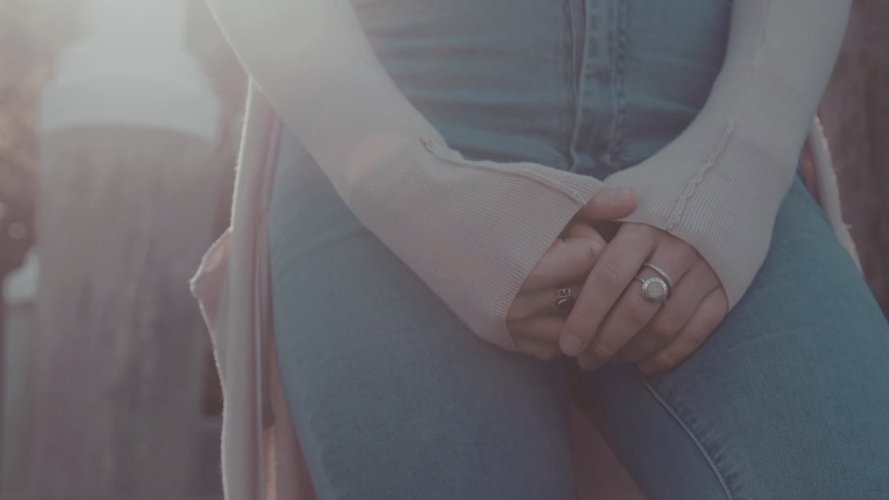 Woman hands, woman waiting on sunny morning