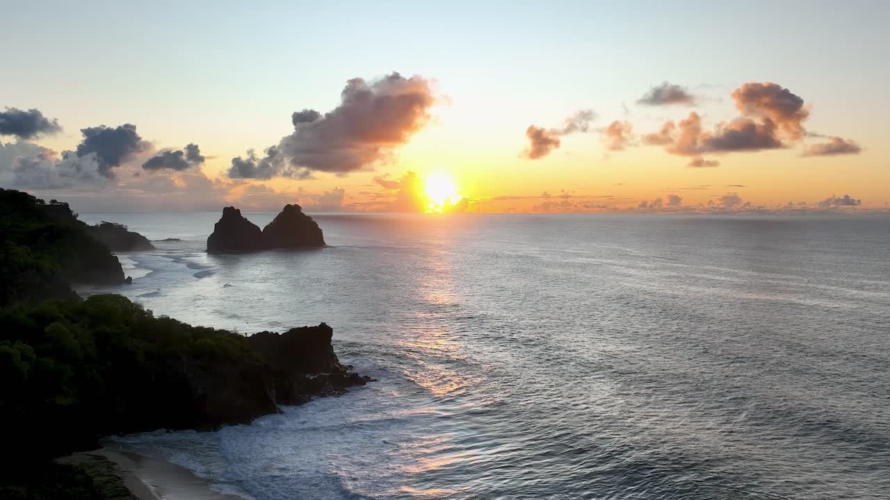 Sunset bay water archipelago of Fernando de Noronha at brazilian atlantic ocean Brazil. Sunset paradise islands at Fernando de Noronha archipelago. Sunset summer travel. Tropical destinations.