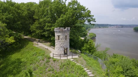 aerial orbiting shot of julien dubuque monument in dubuque, iowa along the mississippi river