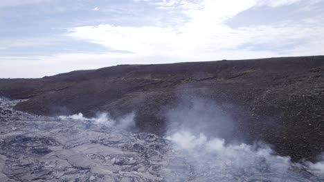 volcanic gas rising from solidified magma due to eruption of geldingadalir volcano in iceland