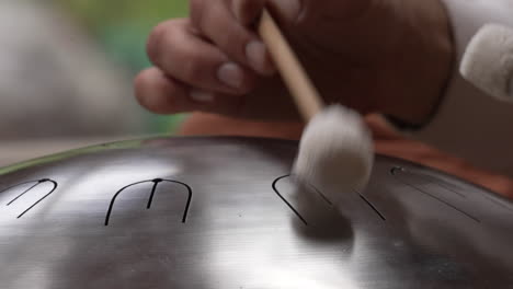 The-Handpan-is-Gently-Tapped-During-the-Sound-Bath-in-the-Sacred-Valley,-Cuzco-Region,-Peru---Close-Up