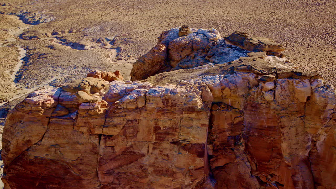 Sweeping drone footage rising from a striking rock structure to reveal the breathtaking view of Lake Powell near Page, Arizona.