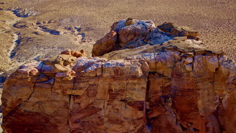 sweeping drone footage rising from a striking rock structure to reveal the breathtaking view of lake powell near page, arizona.