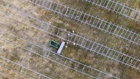 drone shot of a solar field being constructed, downward angle