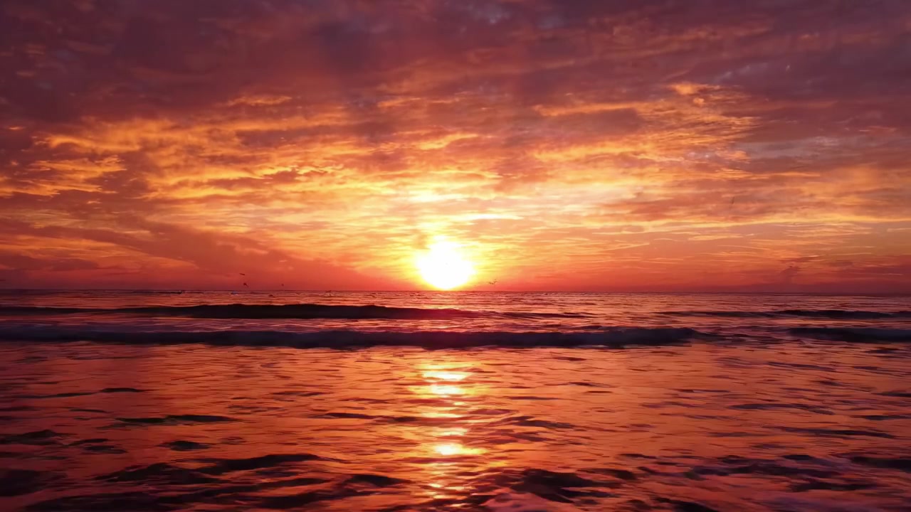 A Breathtaking Sunset Over the Ocean, Highlighting Vibrant Colors and Calming Waves, Capturing the Beauty of Nature's Evening Show