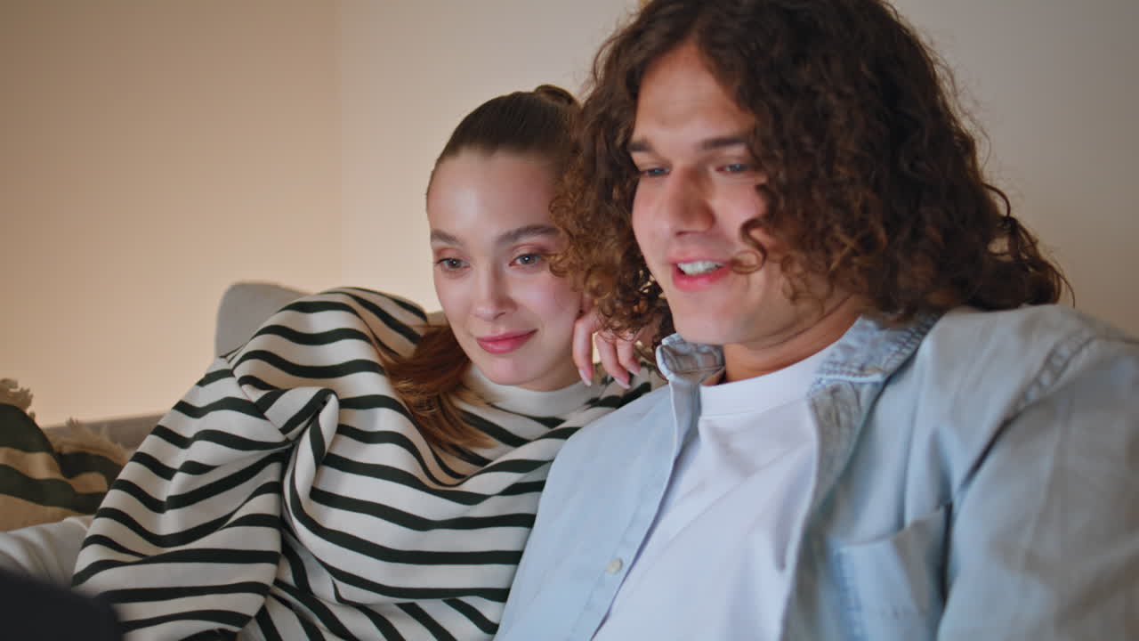 Married pair talking laptop camera enjoy online conversation at couch closeup