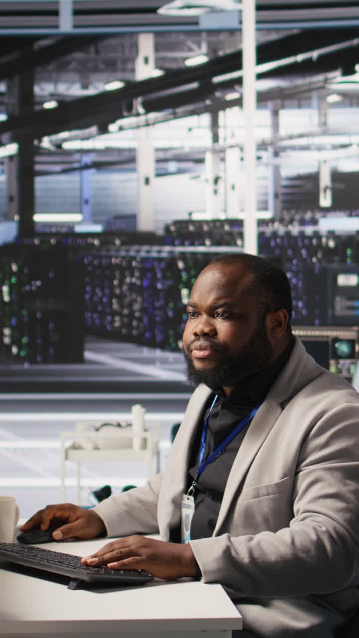 Vertical video Lead data center technician overseeing team integrating AI automation in rigs