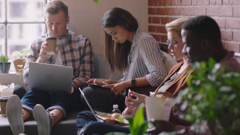 diverse business people enjoying lunch break eating together enjoying relaxing office brainstorming discussing creative ideas friends collaborating in relaxed meeting