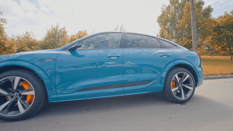 audi e tron profile view. audi e tron, a fully electric car on highway