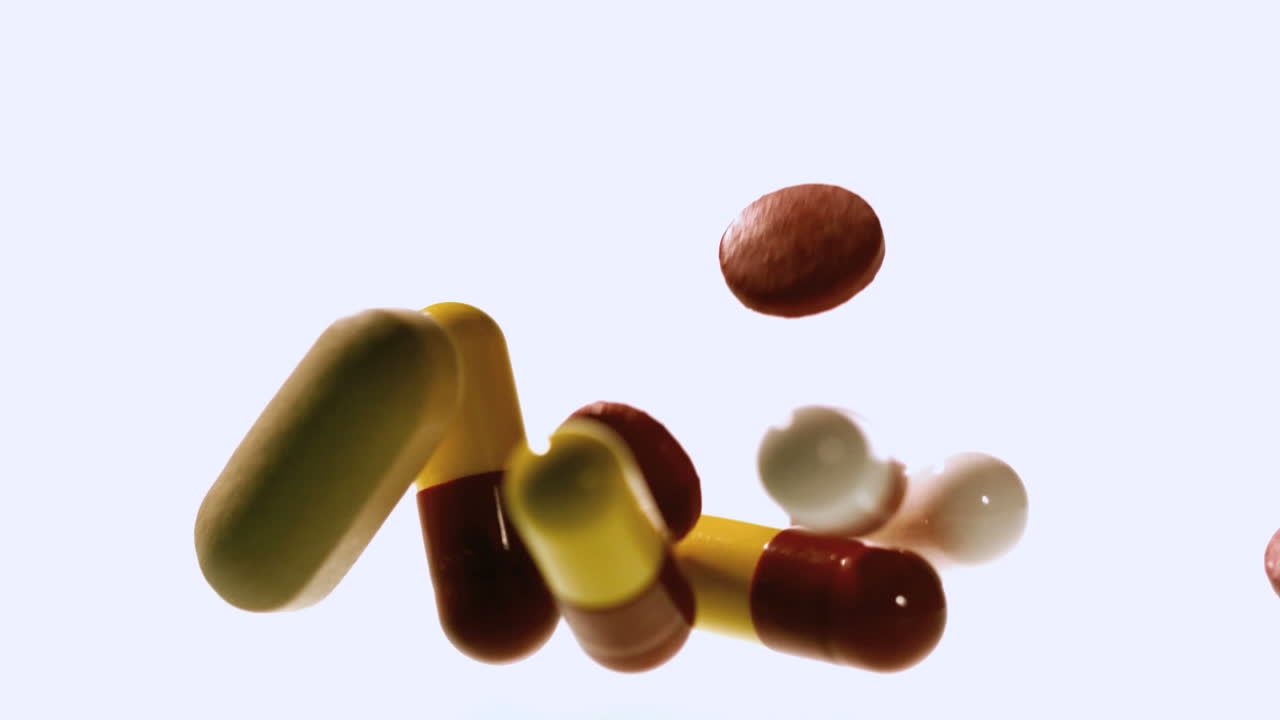 diferentes tipos de comprimidos que caen y rebotan