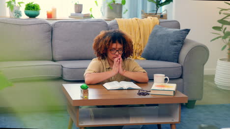 Christian-woman,-bible-and-prayer-in-home-lounge