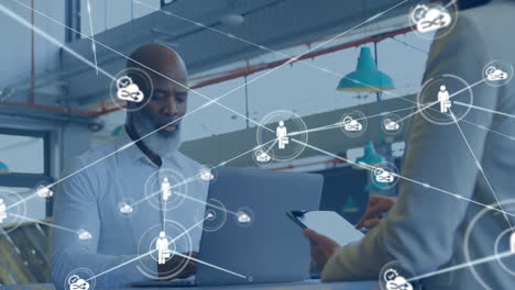 animation of network of connections with people icons over diverse business people with tablets