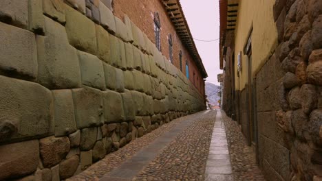 unique shot of twelve-angled stone monument on hatunrumiyoc street in cusco, peru, with no people and tourists