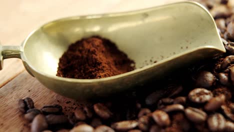 coffee beans with powder and scoop